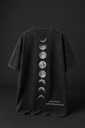 Black t-shirt with moon phase design on a dark background