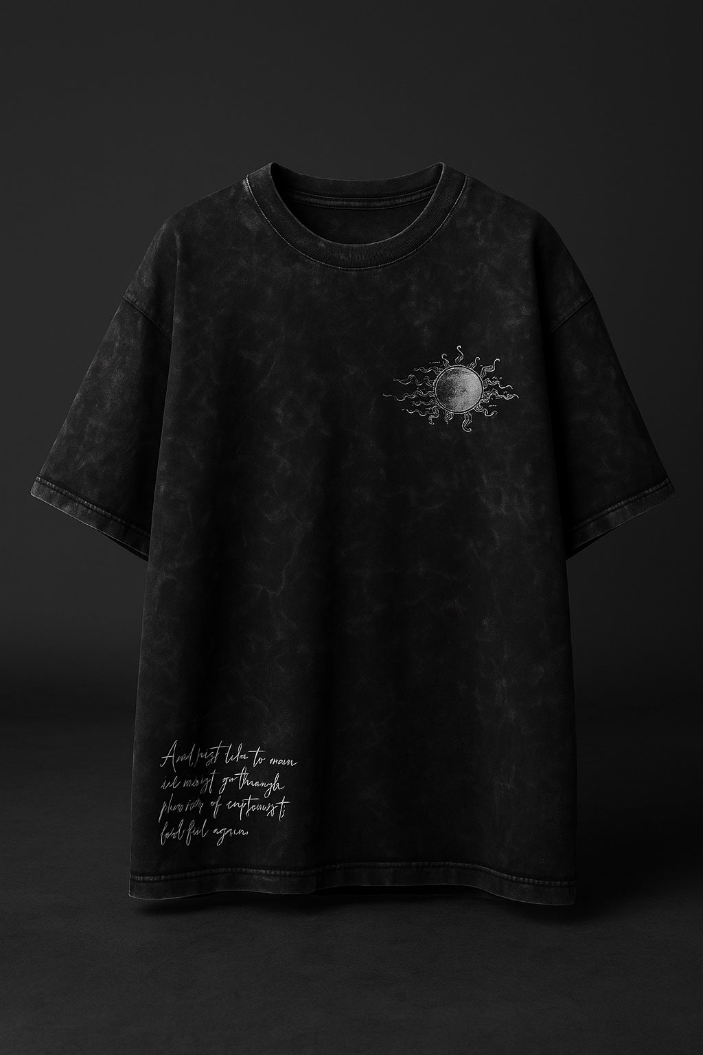 Black t-shirt with a small graphic on a dark background