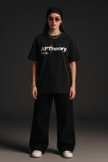 Person wearing a black 'AFTheory' t-shirt on a dark background
