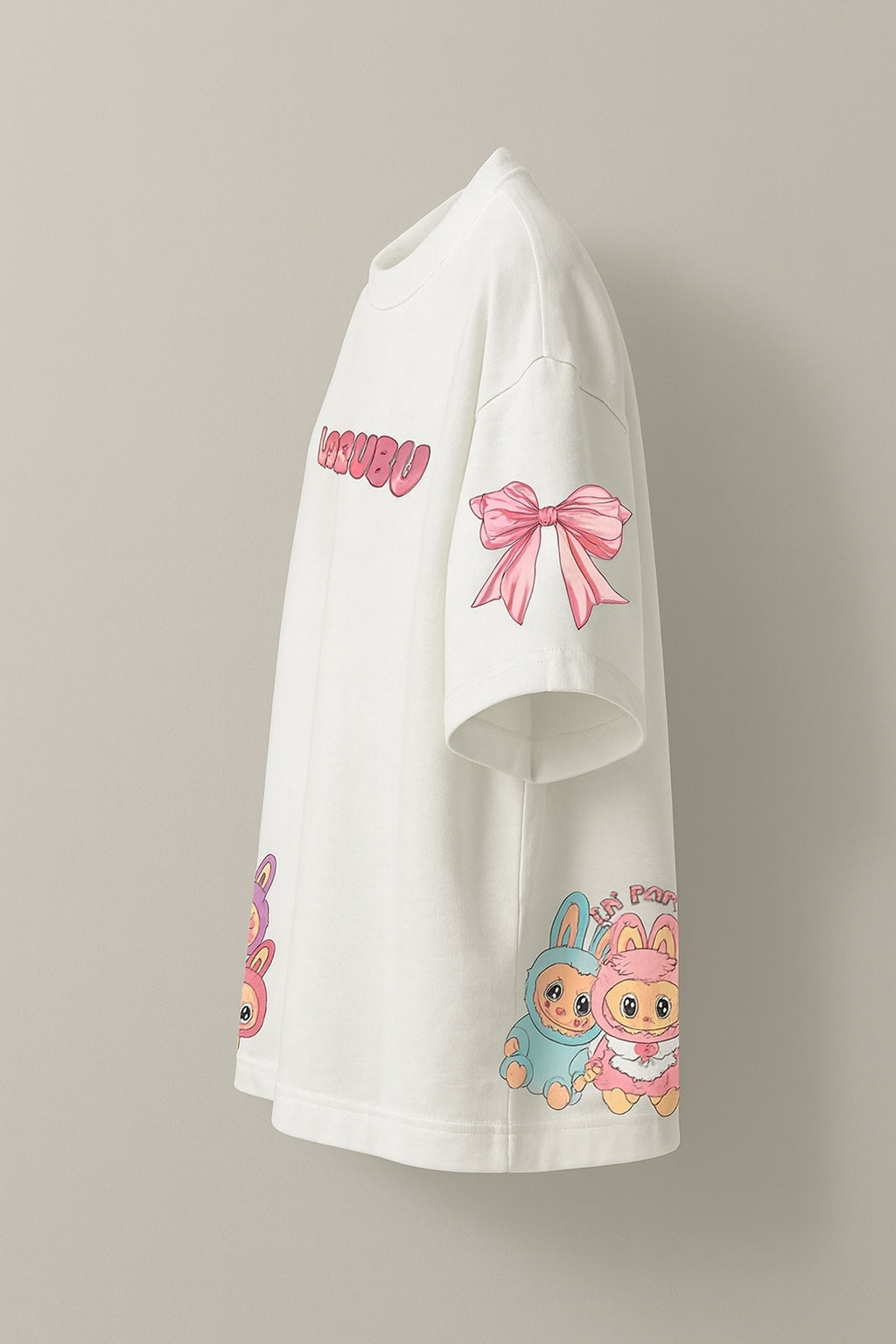 White hoodie with cartoon characters and a pink bow on a beige background