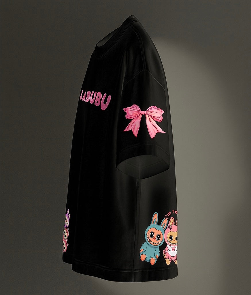 Black sweatshirt with pink bow and cartoon characters on a dark background