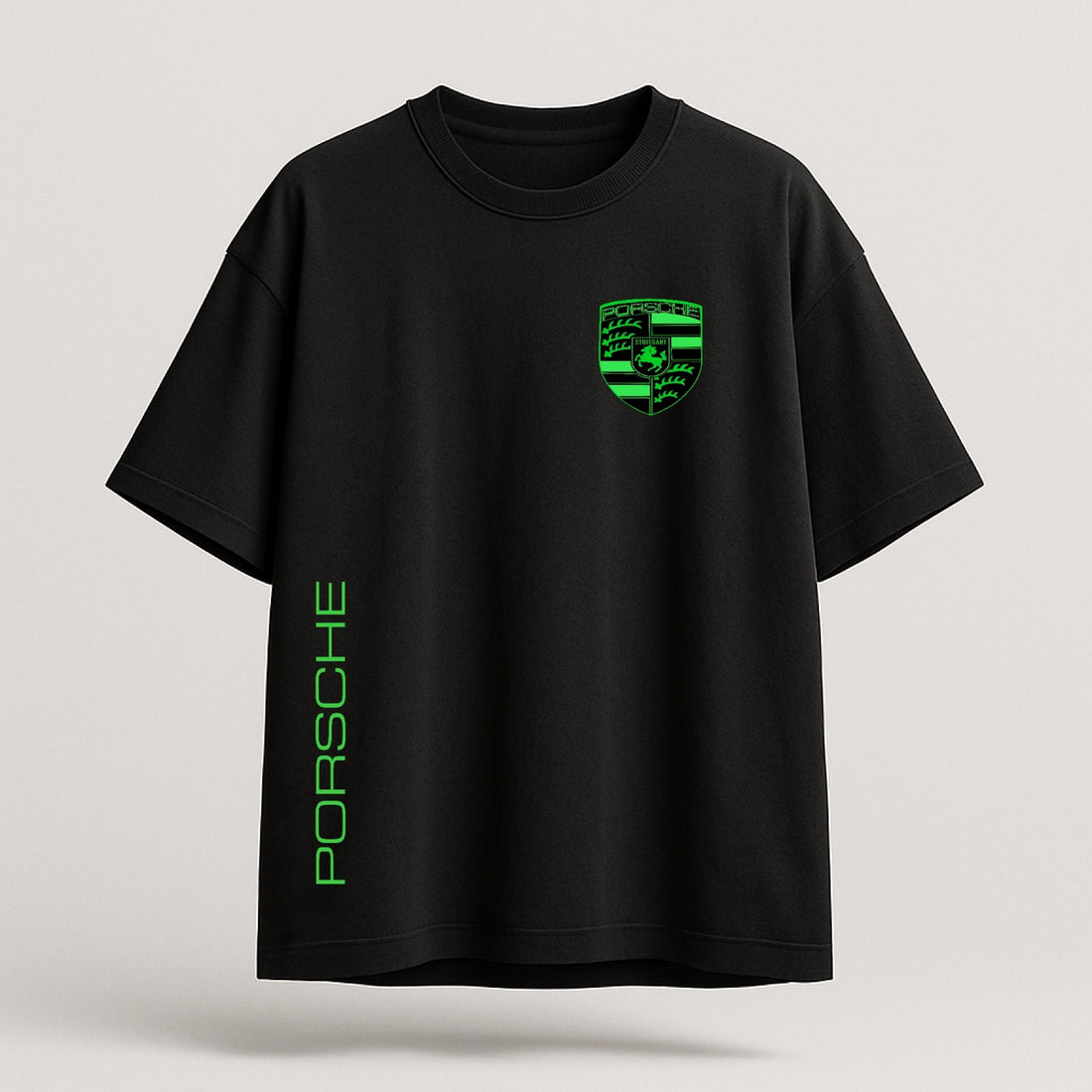 Black t-shirt with green Porsche logo and text on a light gray background