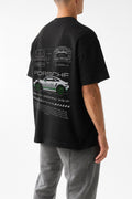Person wearing a black t-shirt with Porsche car design on the back